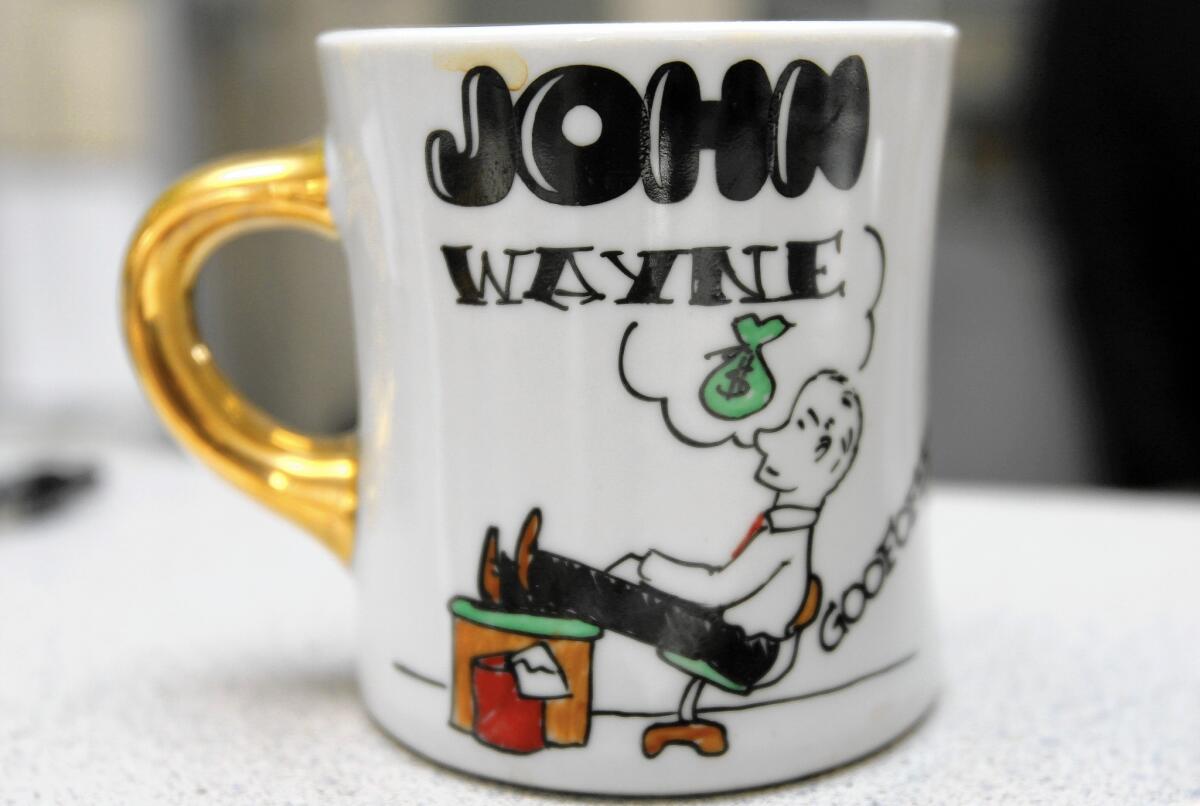 This coffee mug once belonged to John Wayne, who was a member of the Goofoffers, a Newport Beach group that met for breakfast in the 1950s.