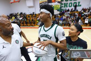 Jason Crowe Jr. of Inglewood gets emotional with his grandfather, Kenneth, and mother Irene.