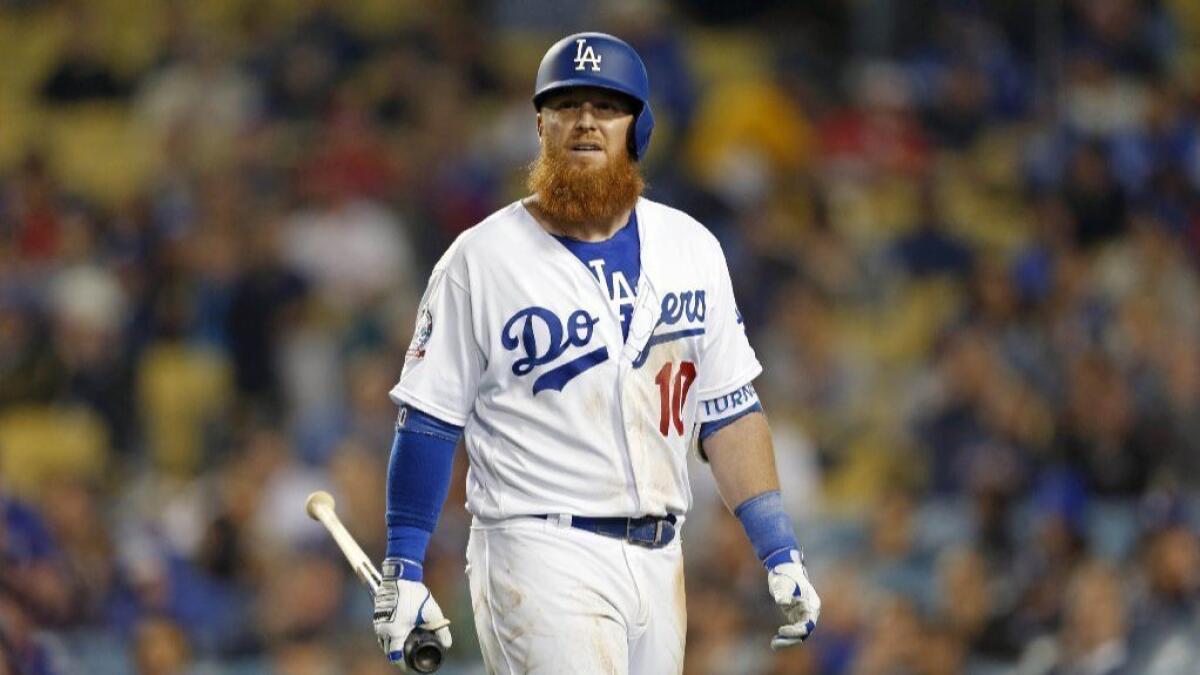 Dodgers third baseman Justin Turner walks back to the dug out after popping out during the sixth inning of a game against the Phillies on Tuesday.