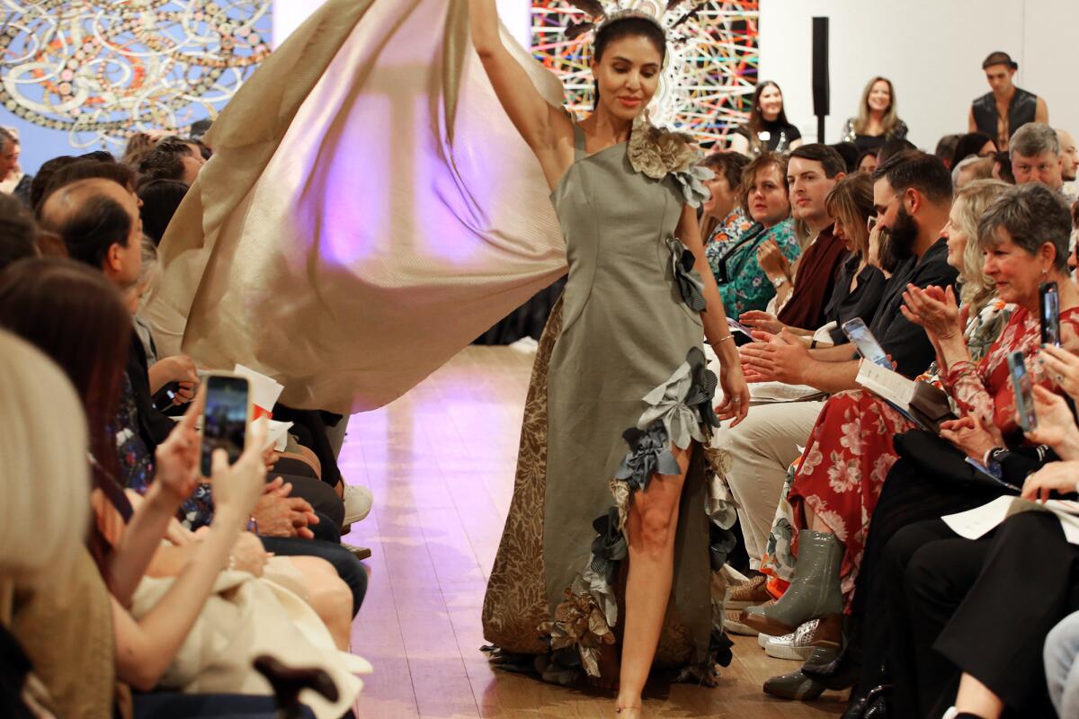 A model walks the runway during the upcycled couture fashion show at Laguna Art Museum on Nov. 2.