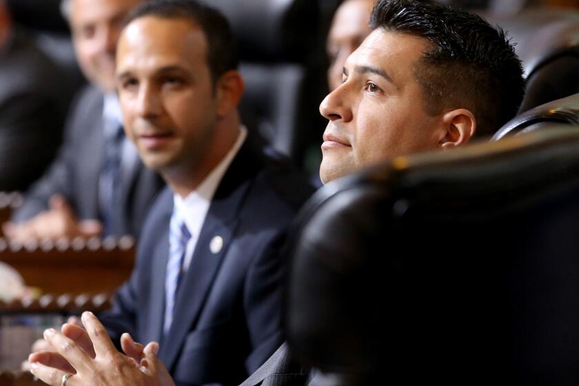 L.A. Councilman Felipe Fuentes, right, shown seated next to L.A. Councilman Mitchell Englander, announced Friday that he will not run for a second term.