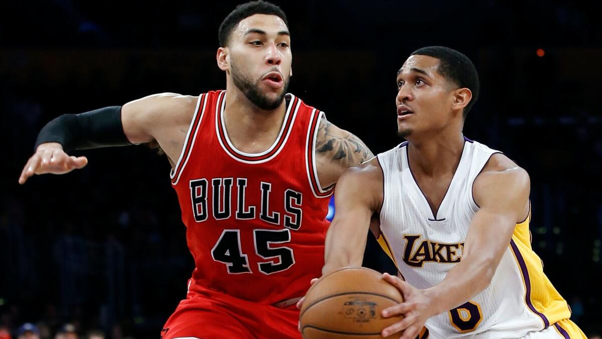 Lakers' Jordan Clarkson drives through the lane against Chicago's Denzel Valentine on Sunday.