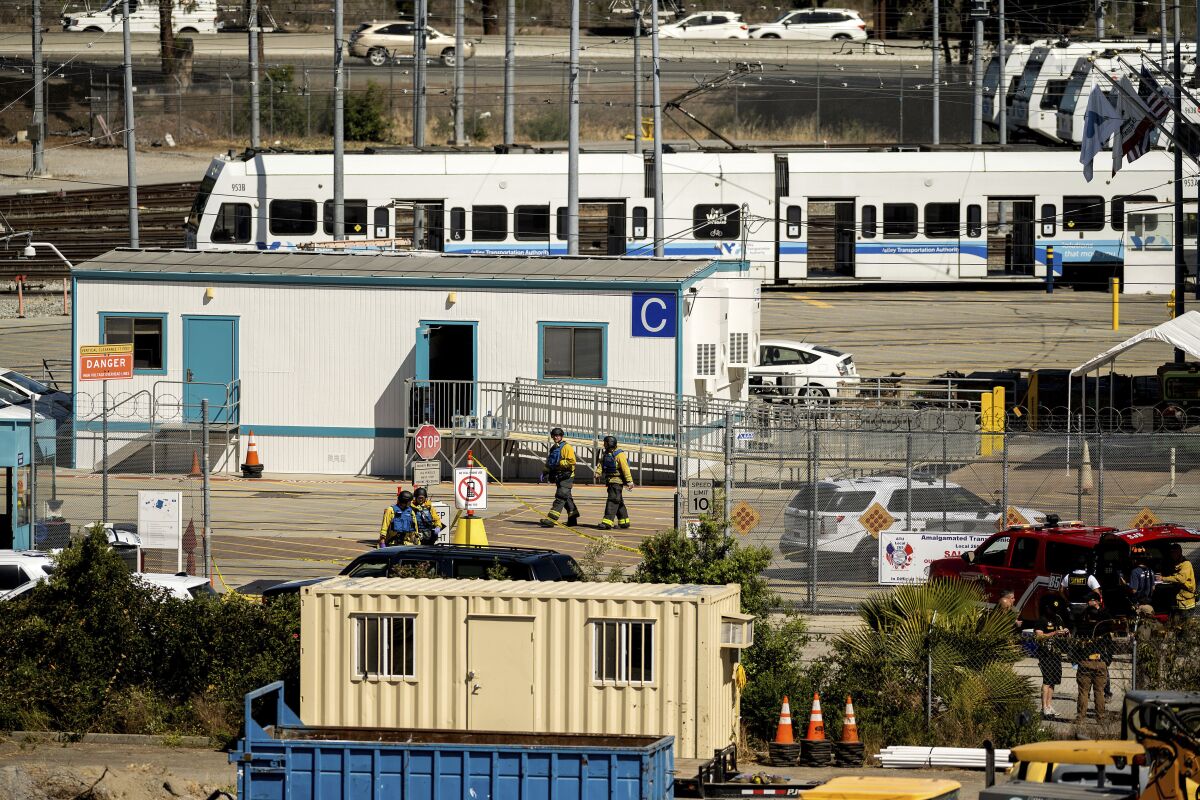 Emergency personnel at a light rail yard