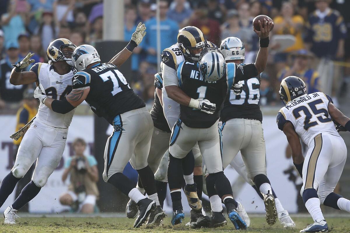 Rams defensive lineman Aaron Donald sacks Panthers quarterback Cam Newton early in the fourth quarter.