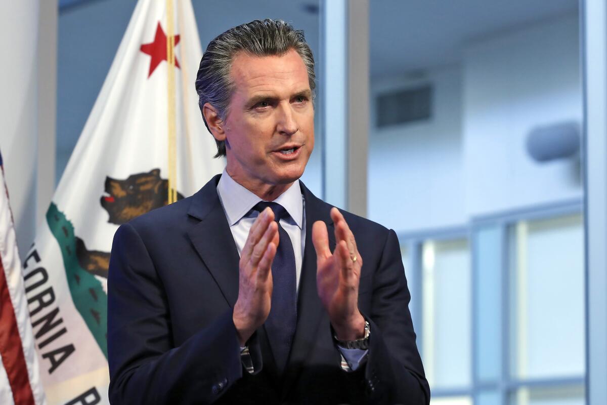 FILE - In this April 14, 2020, file photo, California Gov. Gavin Newsom discusses an outline for what it will take to lift coronavirus restrictions during a news conference at the Governor's Office of Emergency Services in Rancho Cordova, While California will end most coronavirus rules on June 15, Gov. Gavin Newsom said Friday, June 4, 2021 he will not lift the “state of emergency” that has been in place since March 2020. (AP Photo/Rich Pedroncelli, Pool, File)