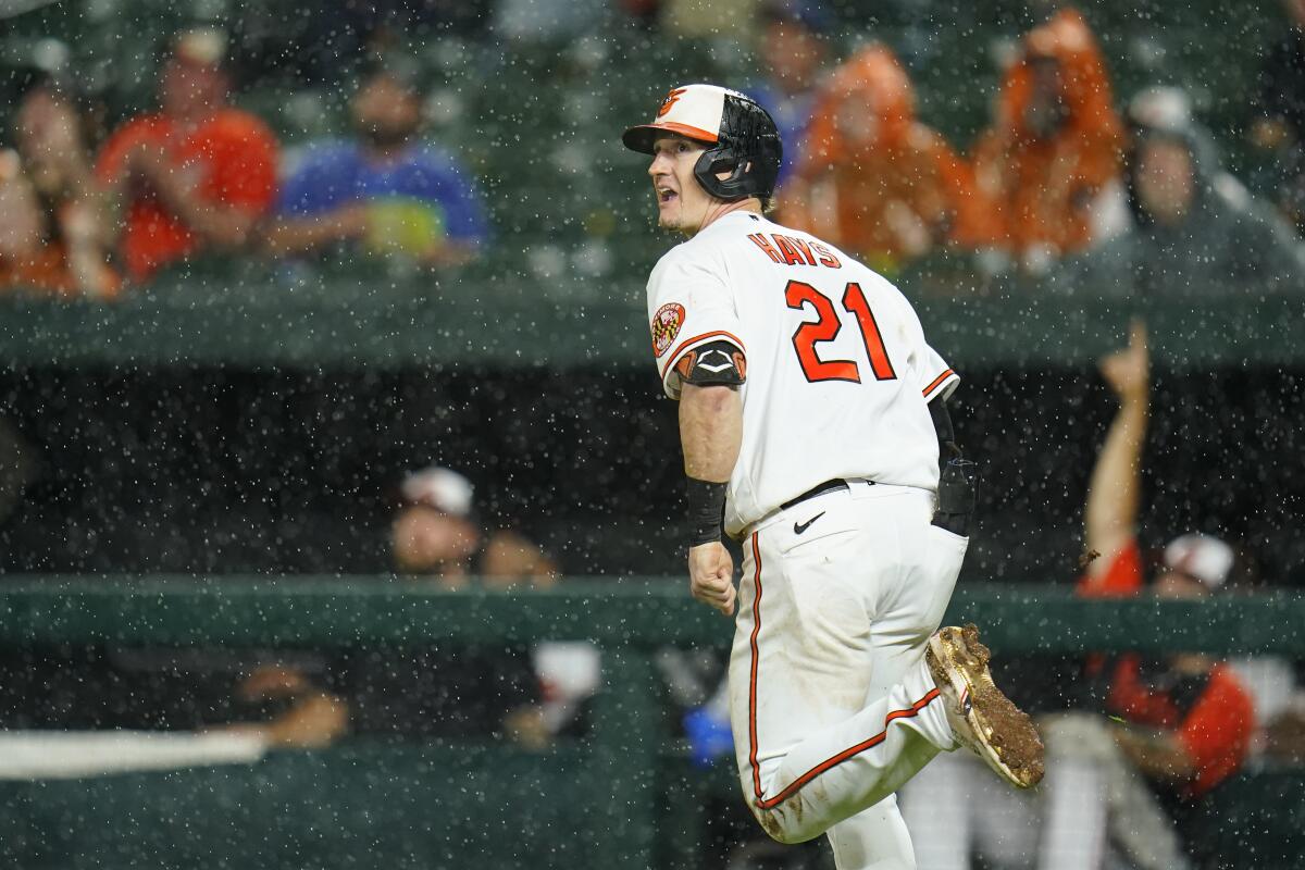 Baltimore Orioles' Austin Hays watches his ball as he hits a solo home run against the Chicago Cubs during the fifth inning of a baseball game, Tuesday, June 7, 2022, in Baltimore. (AP Photo/Julio Cortez)