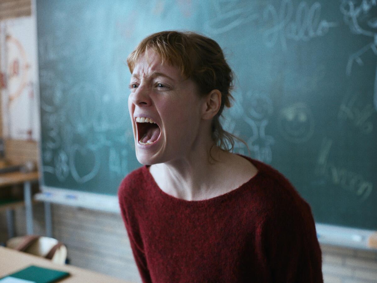 Leonie Benesch stands in front of a chalkboard and screams in "The Teachers' Lounge." 