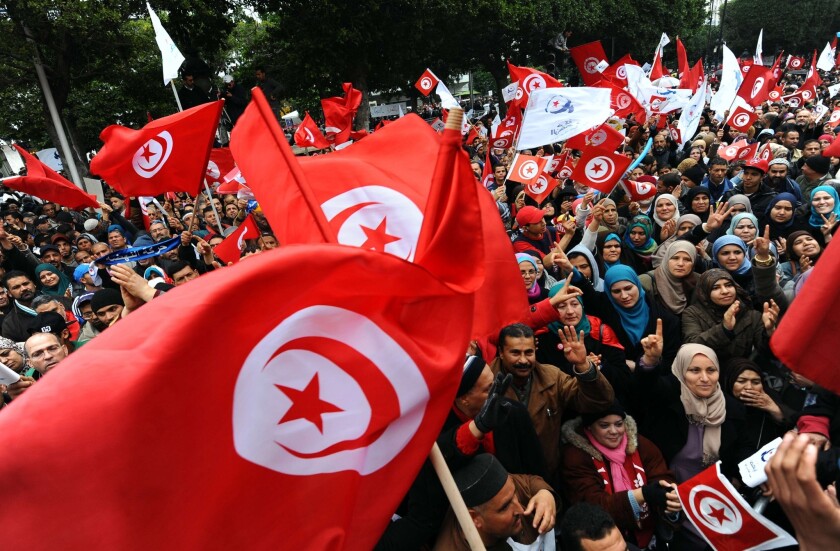 Tunisians in 2014 celebrate the third anniversary of the uprising that ousted Zine el Abidine ben Ali.