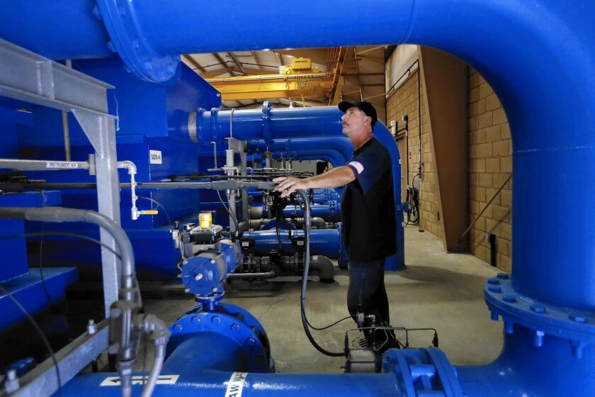 Chief water system operator Cliff Bellinghausen at Riverside's John W. North Water Treatment Plant. The city considers itself "water independent," and officials have balked at an order from the state to cut back significantly on water use.