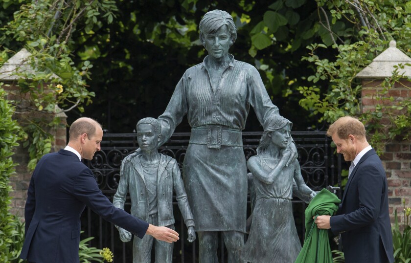 Prince William and Prince Harry with a statue of their mother