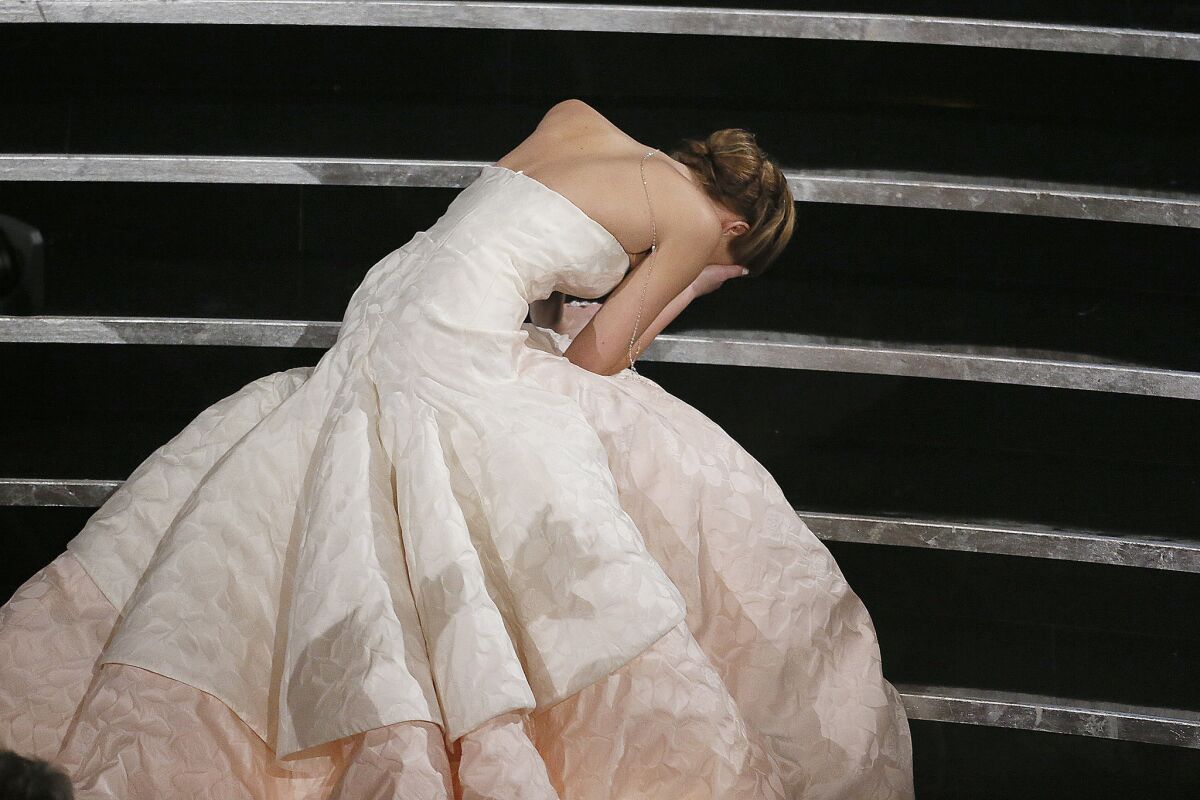 Jennifer Lawrence proved she is just as human as the rest of us when she tripped on the stairs on the way to accept her best actress Oscar at the 85th Academy Awards. After making it to the stage to a standing ovation, she confronted the situation head-on by saying, "You guys are just standing up because you feel bad that I fell and that's really embarrassing, but thank you."