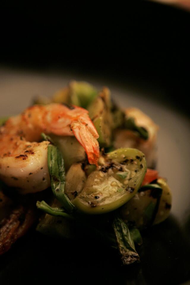 Grilled shrimp with tomatillos can be a lighter alternative to the burgers and dogs.