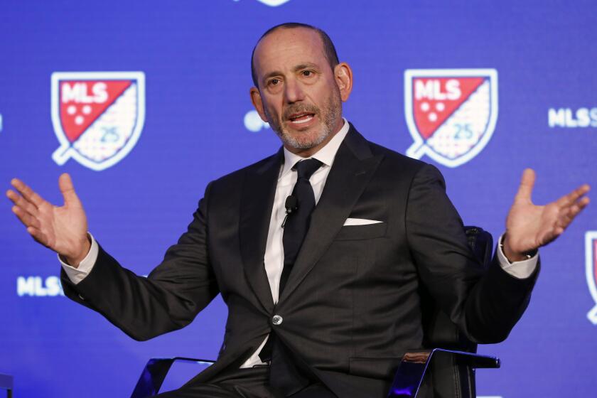 FILE - In this Feb. 26, 2020, file photo, Major League Soccer Commissioner Don Garber speaks during the leagues 25th Season kickoff event in New York. Major League Soccer and its players' union reached an agreement that paves the way for a summer tournament in Florida after the season was suspended by the coronavirus pandemic. The deal was announced by the Major League Soccer Players Association early Wednesday, June 3, 2020, following tense talks that led to some players skipping voluntary workouts and the league threatening a lockout.(AP Photo/Richard Drew, File)