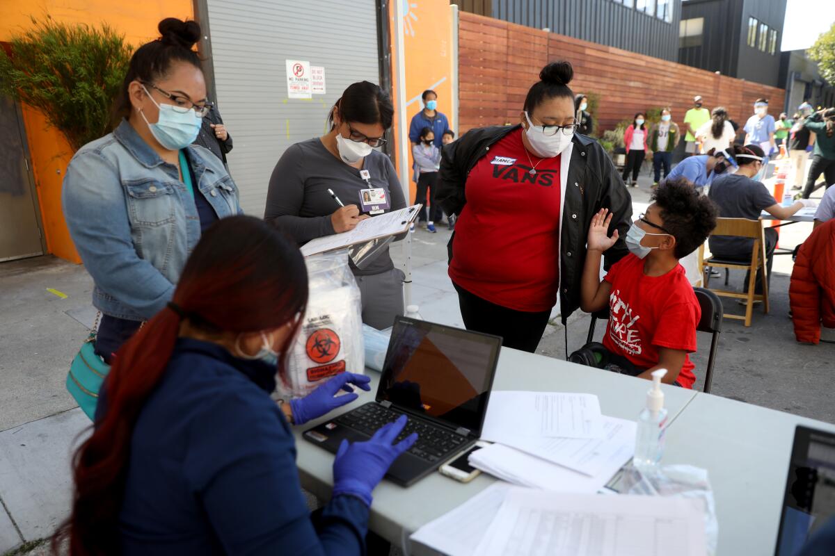 Residents of San Francisco's Mission District and surrounding areas sign up for COVID-19 testing.