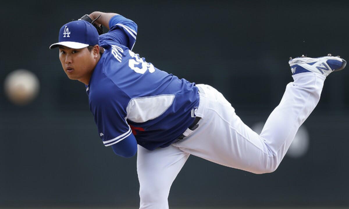 Dodgers starter Hyun-Jin Ryu pitches during an exhibition game against the Chicago White Sox on Feb. 28. Ryu finishes spring training with a 2.20 earned-run average.