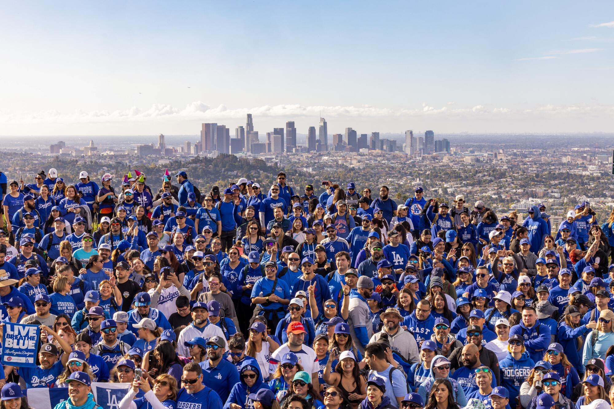 Hikers dressed in Dodger Blue gather for a group photo midway through a 6.5-mile hike through Griffith Park. 