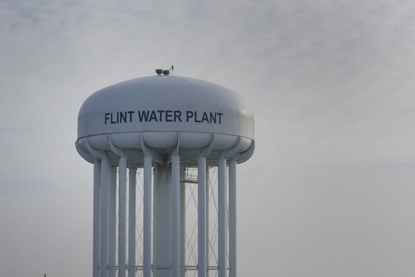 The Flint Water Plant tower is shown in Flint, Mich., Wednesday, Jan. 13, 2021. Some Flint residents impacted by months of lead-tainted water are looking past expected charges against former Gov. Rick Snyder and others in his administration to healing physical and emotional damages left by the crisis. (AP Photo/Paul Sancya)