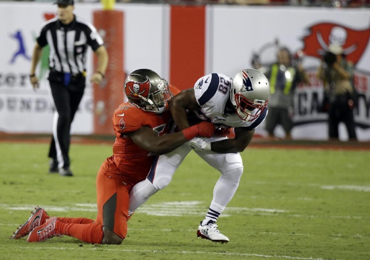 Buccaneers rookie linebacker Kendall Beckwith tackles Patriots running back James White during the first half of a game on Oct. 5.