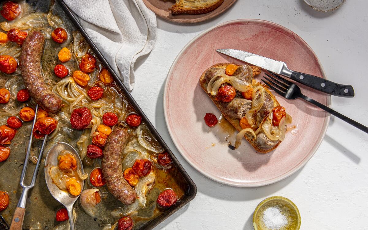 Italian sausages roast up with onions and tomatoes in this simple sheet pan dinner. Prop styling by Sean Bradley.