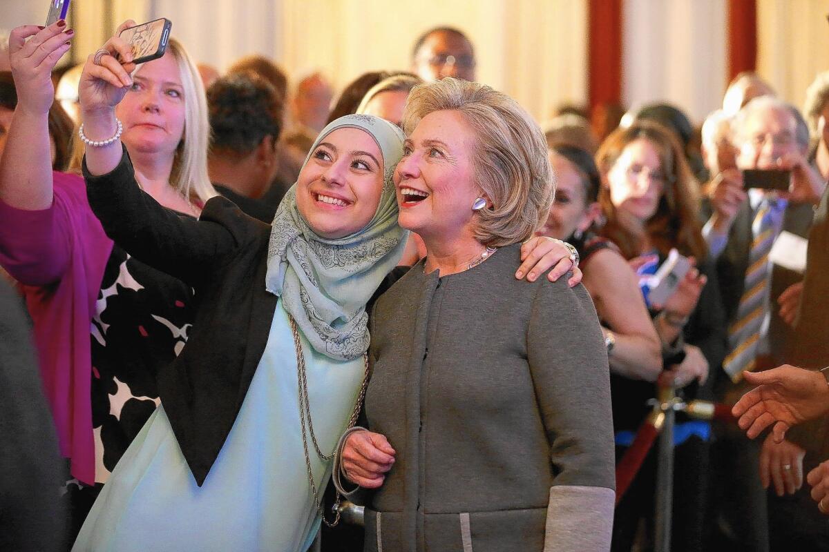 Former Secretary of State Hillary Rodham Clinton poses for a photo during the Legal Services Corp.'s 40th anniversary conference in Washington. In 1978, Clinton served as the nonprofit's first female chair.