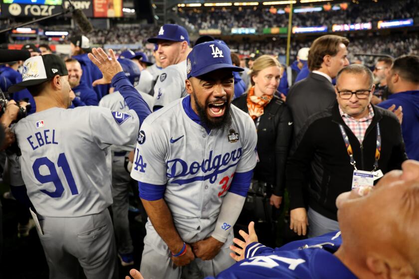 BRONX, NEW YORK - OCTOBER 30, 2024: Los Angeles Dodgers outfielder Teoscar Hernandez (37), center, celebrates on the field. Game 5 of the World Series against the Yankees at Yankees Stadium in New York City Wednesday, October 30 2024. (Robert Gauthier/Los Angeles Times)