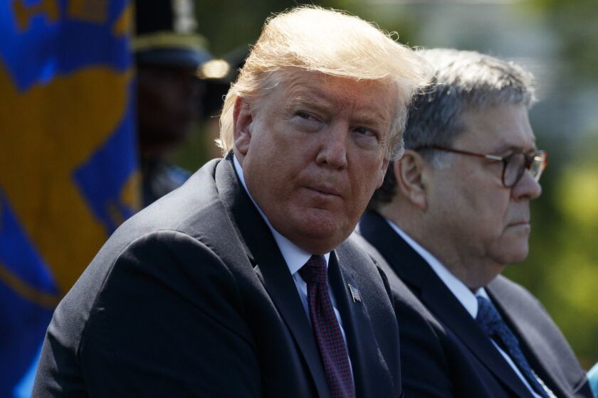 President Donald Trump sits with Attorney General William Barr during the 38th Annual National Peace Officers' Memorial Service at the U.S. Capitol, Wednesday, May 15, 2019, in Washington. (AP Photo/Evan Vucci)
