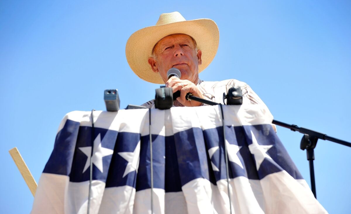 Controversial Nevada rancher Cliven Bundy speaks during a news conference near his ranch in Bunkerville, Nev.