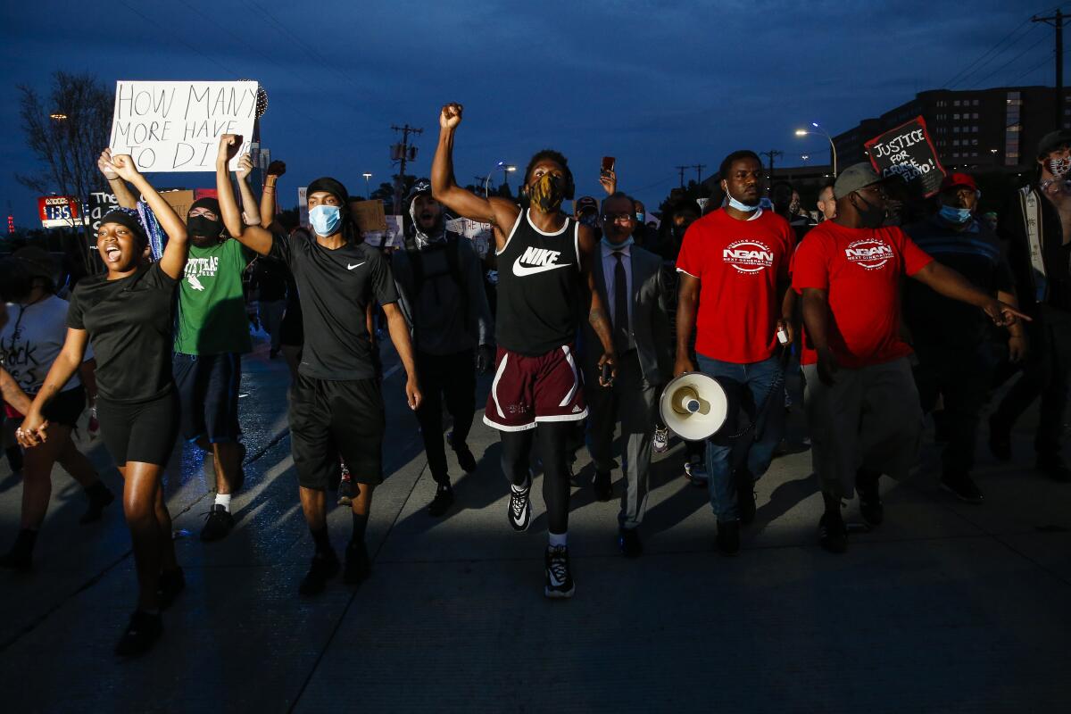 Protesters in Dallas march against police brutality on Monday.
