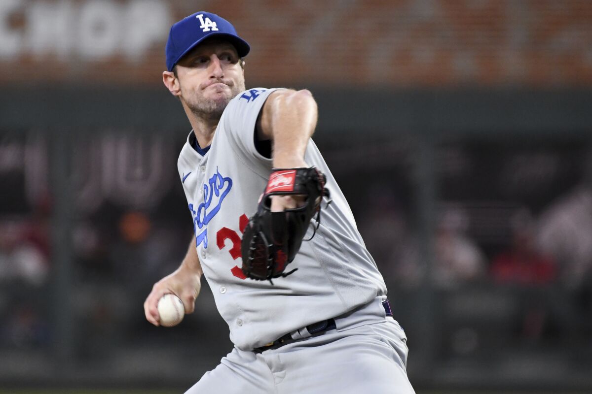 Dodgers pitcher Max Scherzer delivers in Game 2 of the NLCS against the Atlanta Braves on Oct. 17.