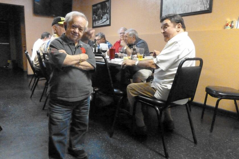 Felix Silla, whose long career in Hollywood included the role of Cousin Itt on "The Addams Family," gathers with friends for pizza in Las Vegas.