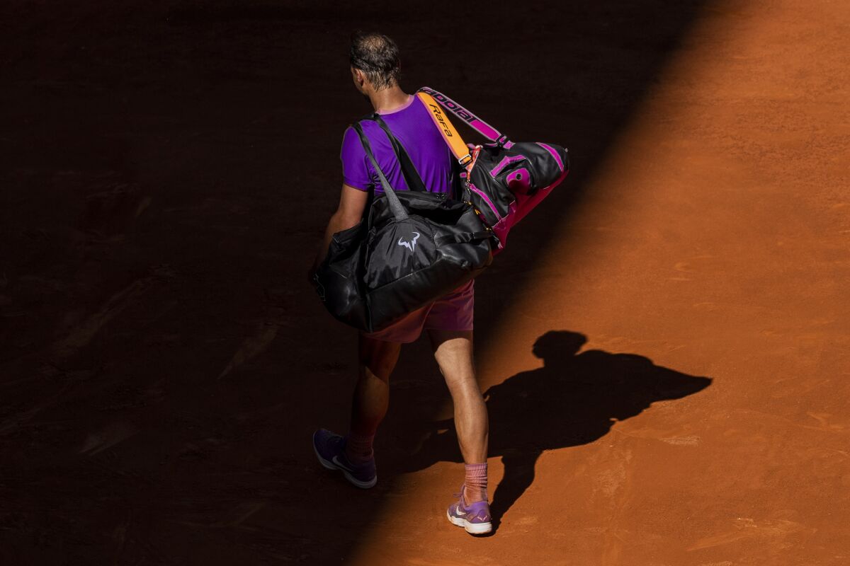 Spain's Rafael Nadal leaves the court after losing against Germany's Alexander Zverev at the Mutua Madrid Open tennis tournament in Madrid, Spain, Friday, May 7, 2021. (AP Photo/Bernat Armangue)