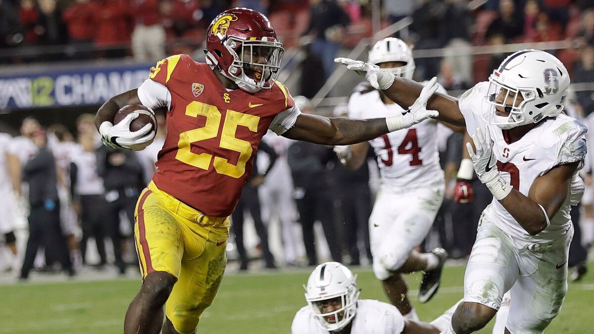 USC running back Ronald Jones II beats Stanford defenders, including safety Justin Reid, for one of his two touchdowns in the second half Friday.
