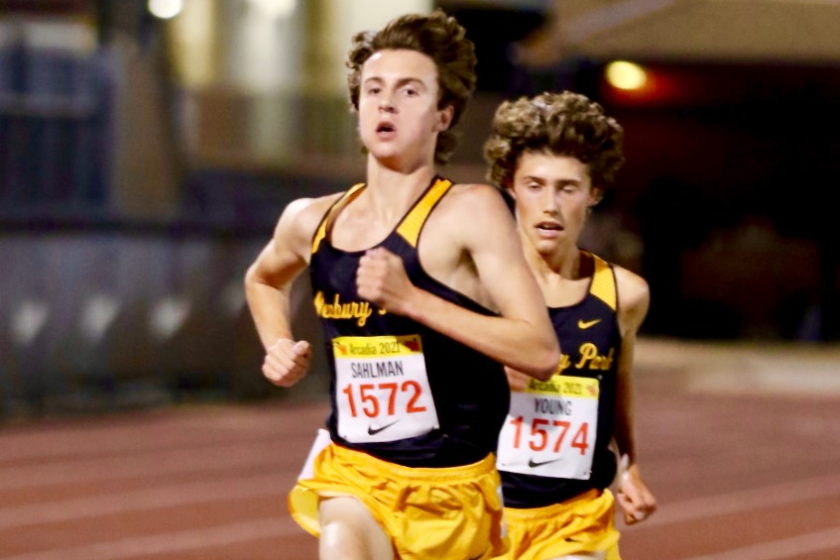 Newbury Park junior Colin Sahlman (left) sprints to the finish line pursued closely by sophomore teammate Lex Young.