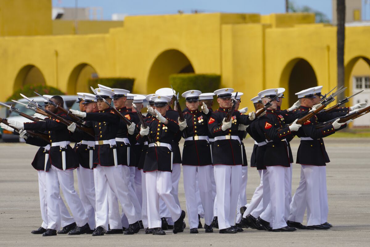 The Silent Drill Platoon performs at Marine Corps Recruit Depot San Diego while holding rifles.