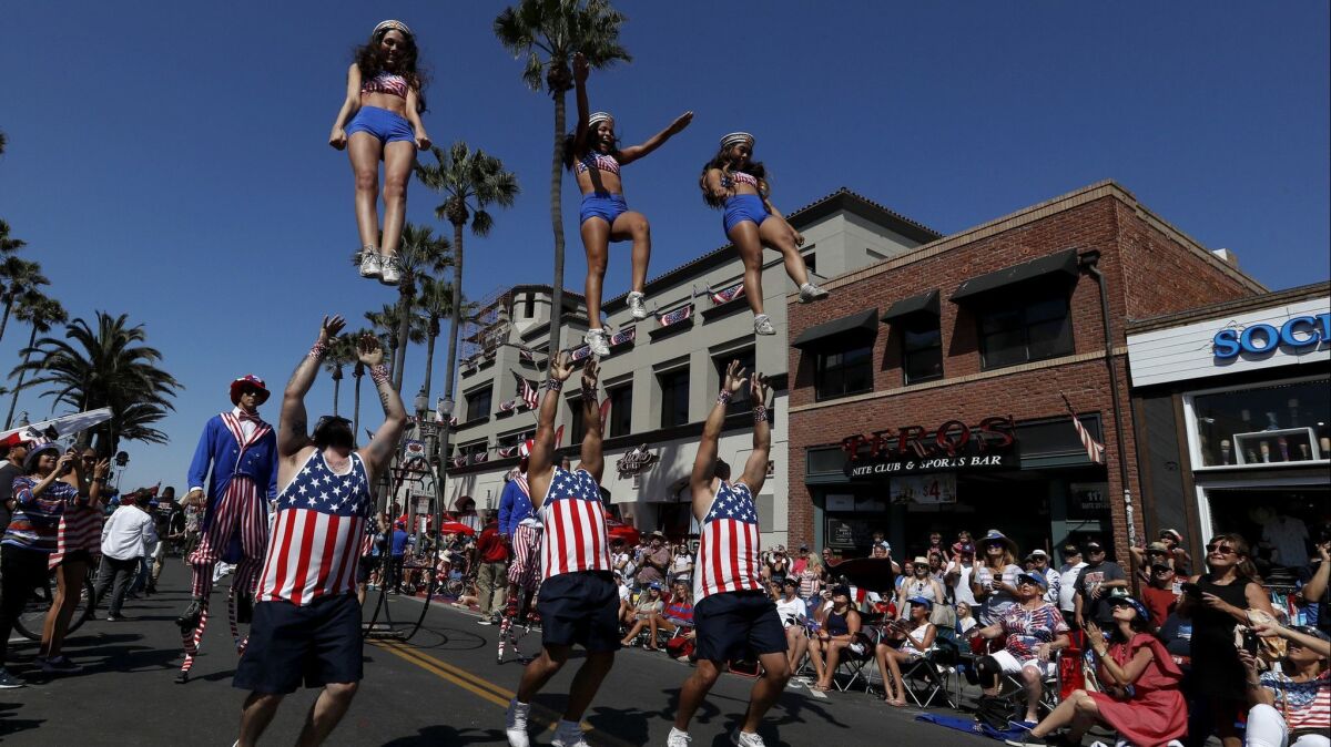 A drill team performs on Main Street in Huntington Beach during the 2018 Independence Day Parade.