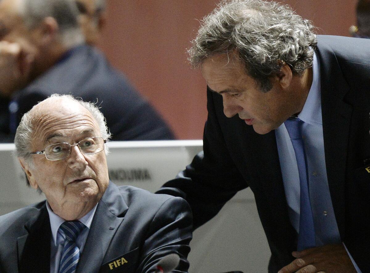 Sepp Blatter, left, and Michel Platini are engaged in conversation.
