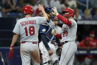 Los Angeles Angels' Brandon Drury (23) celebrates with Nolan Schanuel (18) after his two-run home run off Tampa Bay Rays relief pitcher Erasmo Ramirez during the sixth inning of a baseball game Wednesday, Sept. 20, 2023, in St. Petersburg, Fla. (AP Photo/Chris O'Meara)