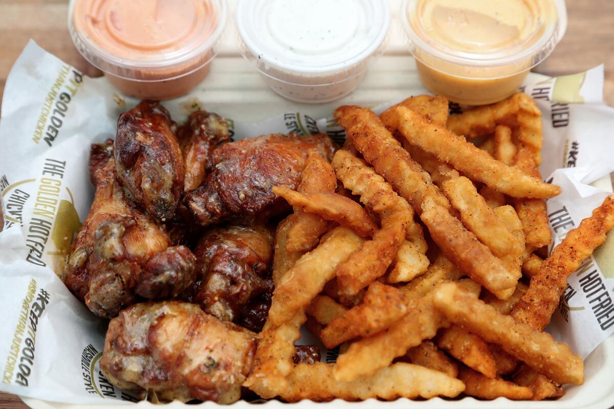 Six-piece parmesan wings with shaken fries at the Golden Eatery at 4th Street Market on June 25.