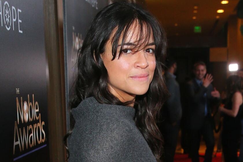 Michelle Rodriguez says she went "pretty crazy" trying to make herself feel again after Paul Walker's death.