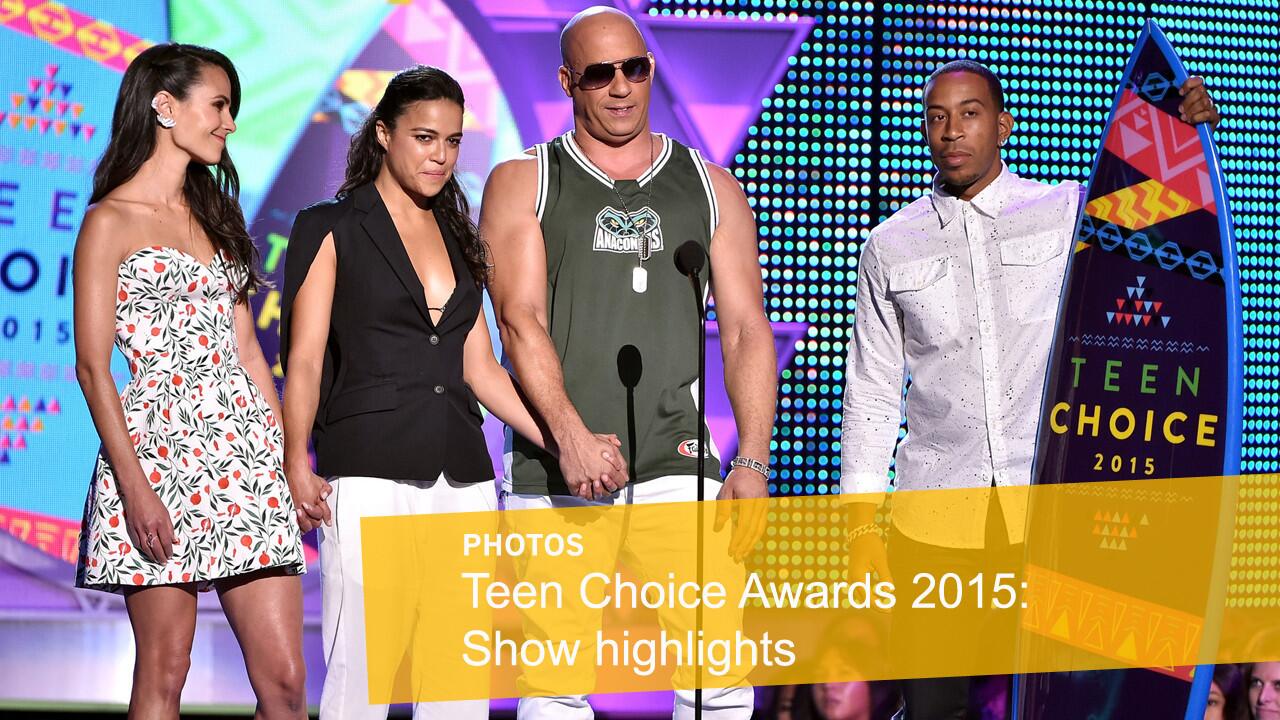 Actors Jordana Brewster, left, Michelle Rodriguez, Vin Diesel and Ludacris accept the action movie award for "Furious 7" at the Teen Choice Awards at USC's Galen Center on Sunday, Aug. 16.