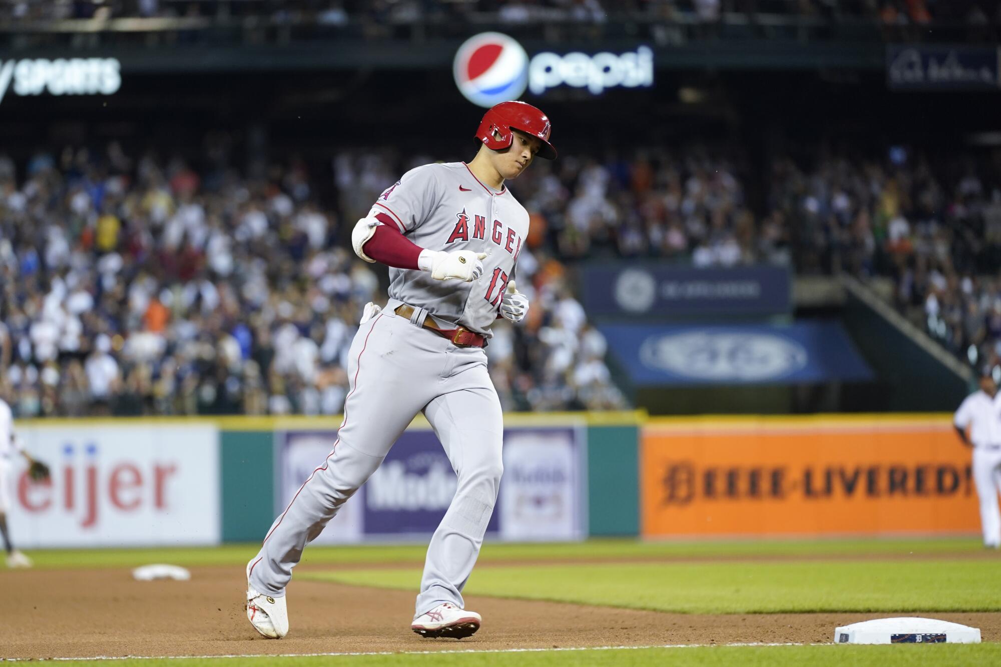 Angels' Shohei Ohtani rounds third base after hitting a solo home run.