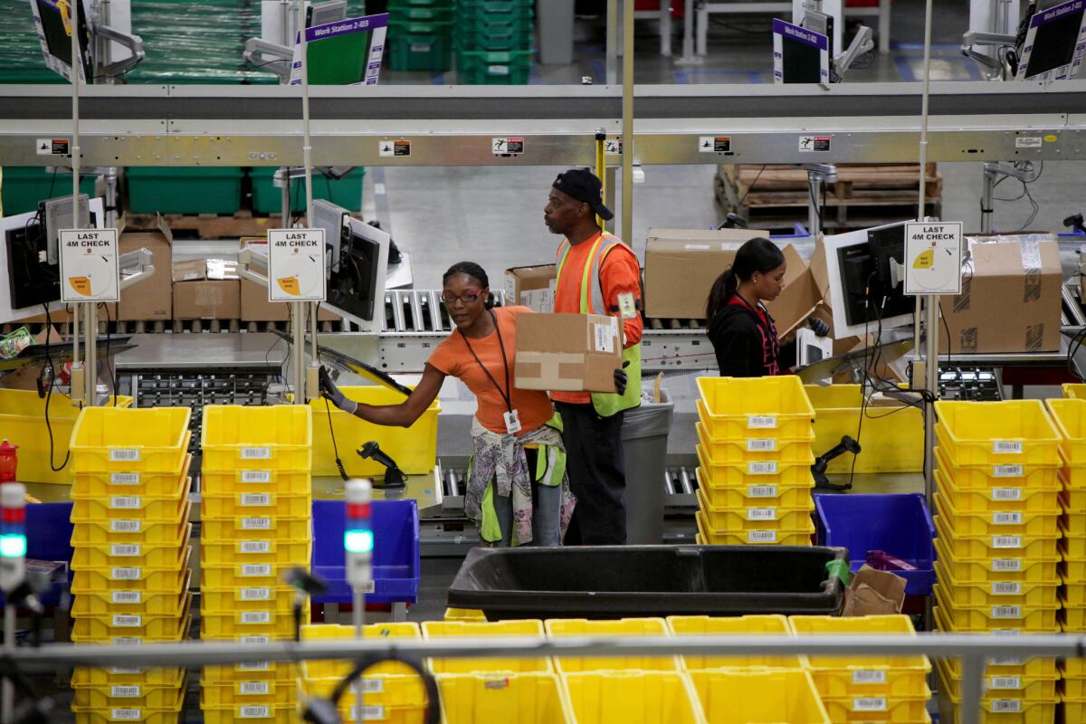 Workers at Amazon's fulfillment center in San Bernardino.