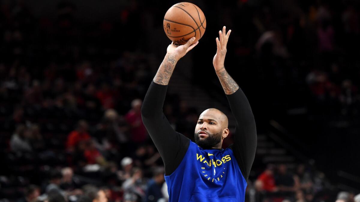 Golden State's DeMarcus Cousins warms up before Game 3 of the Western Conference finals against the Portland Trail Blazers on May 18. Cousins hasn't played since April 15.