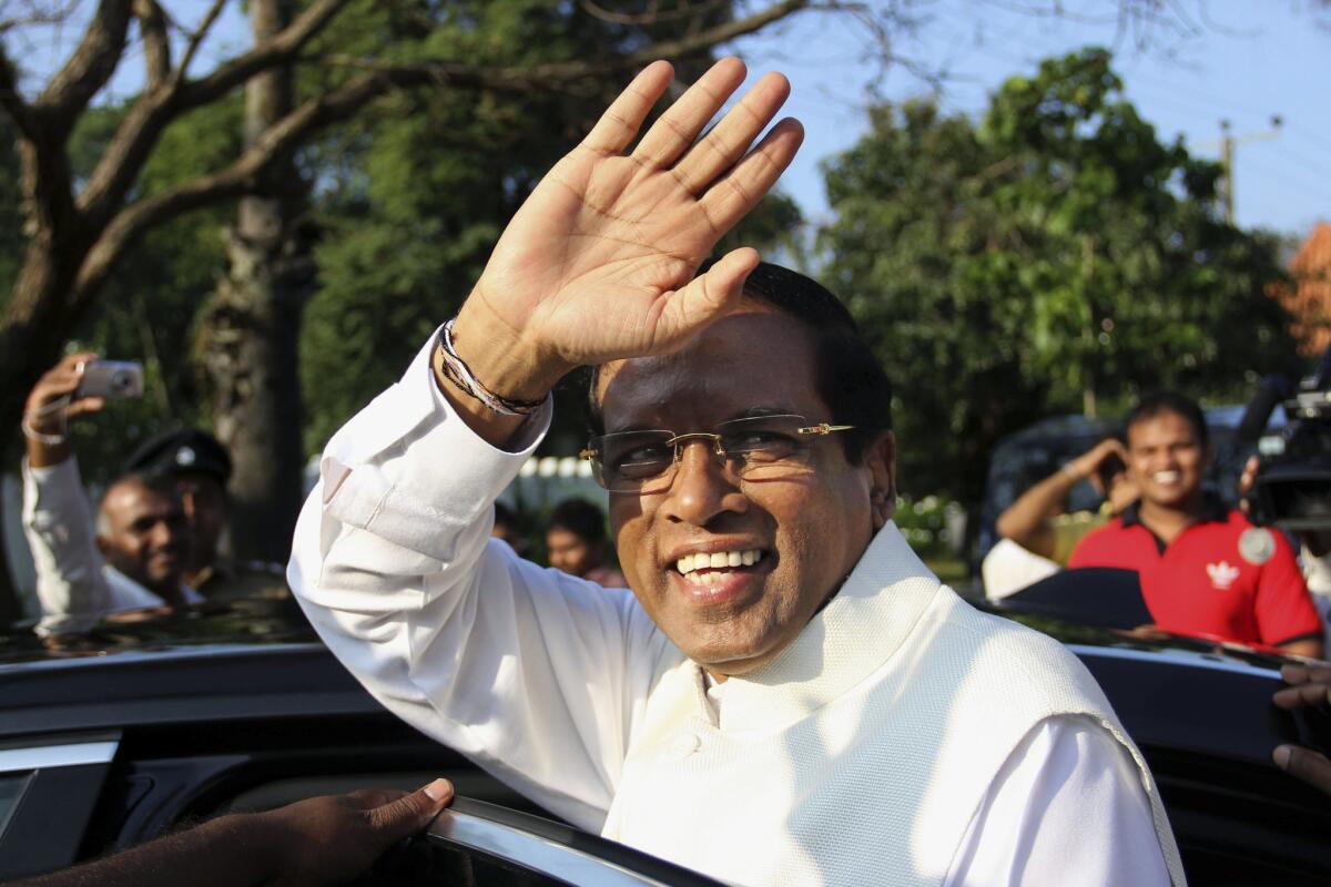 Sri Lanka's main opposition presidential candidate, Maithripala Sirisena, gestures Thursday after casting his vote at a polling station in Polonnaruwa, about 120 miles northeast of Colombo, the capital.