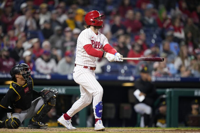 Philadelphia Phillies' Bryce Harper watches after hitting a home run against Pittsburgh Pirates pitcher Jose Hernandez during the seventh inning of a baseball game, Wednesday, Sept. 27, 2023, in Philadelphia. (AP Photo/Matt Slocum)