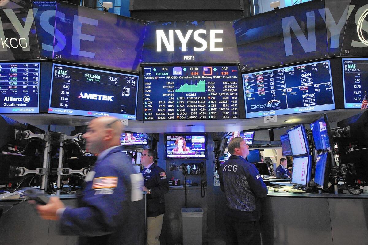 A survey last month by Bankrate.com found that a majority of Wall Street experts expected the Fed to raise the federal funds rate in September. Above, traders work on the NYSE floor.