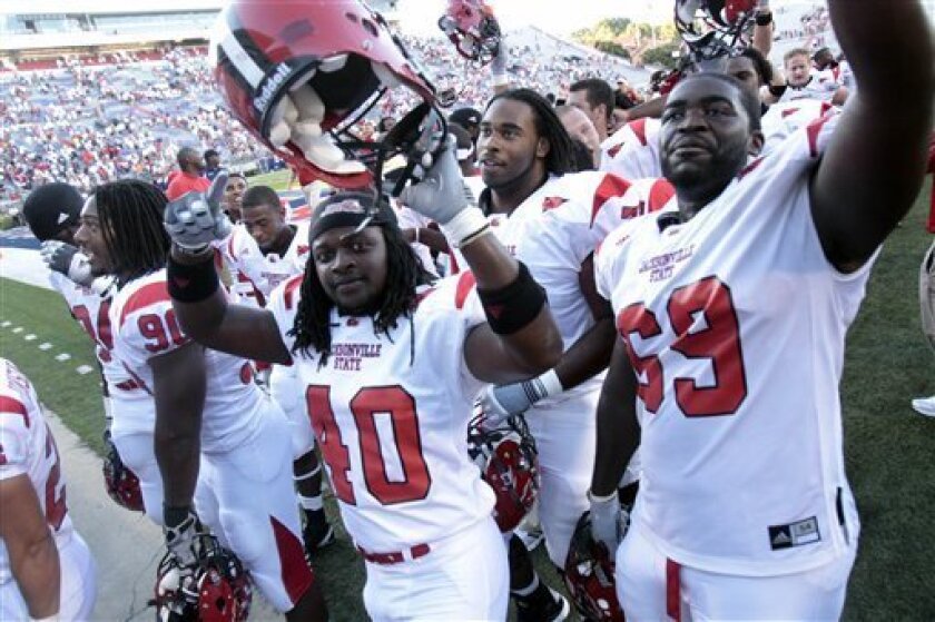 Jacksonville State players celebrate their 49-48 double-overtime victory over Mississippi in an NCAA college football game in Oxford, Miss., Saturday, Sept. 4, 2010. (AP Photo/Rogelio V. Solis)