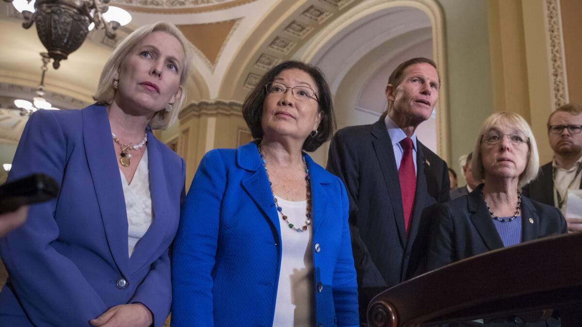 Democratic Sens. Kirsten Gillibrand, from left, Mazie Hirono, Richard Blumenthal and Patty Murray speak with reporters about Supreme Court nominee Brett Kavanaugh on Tuesday.