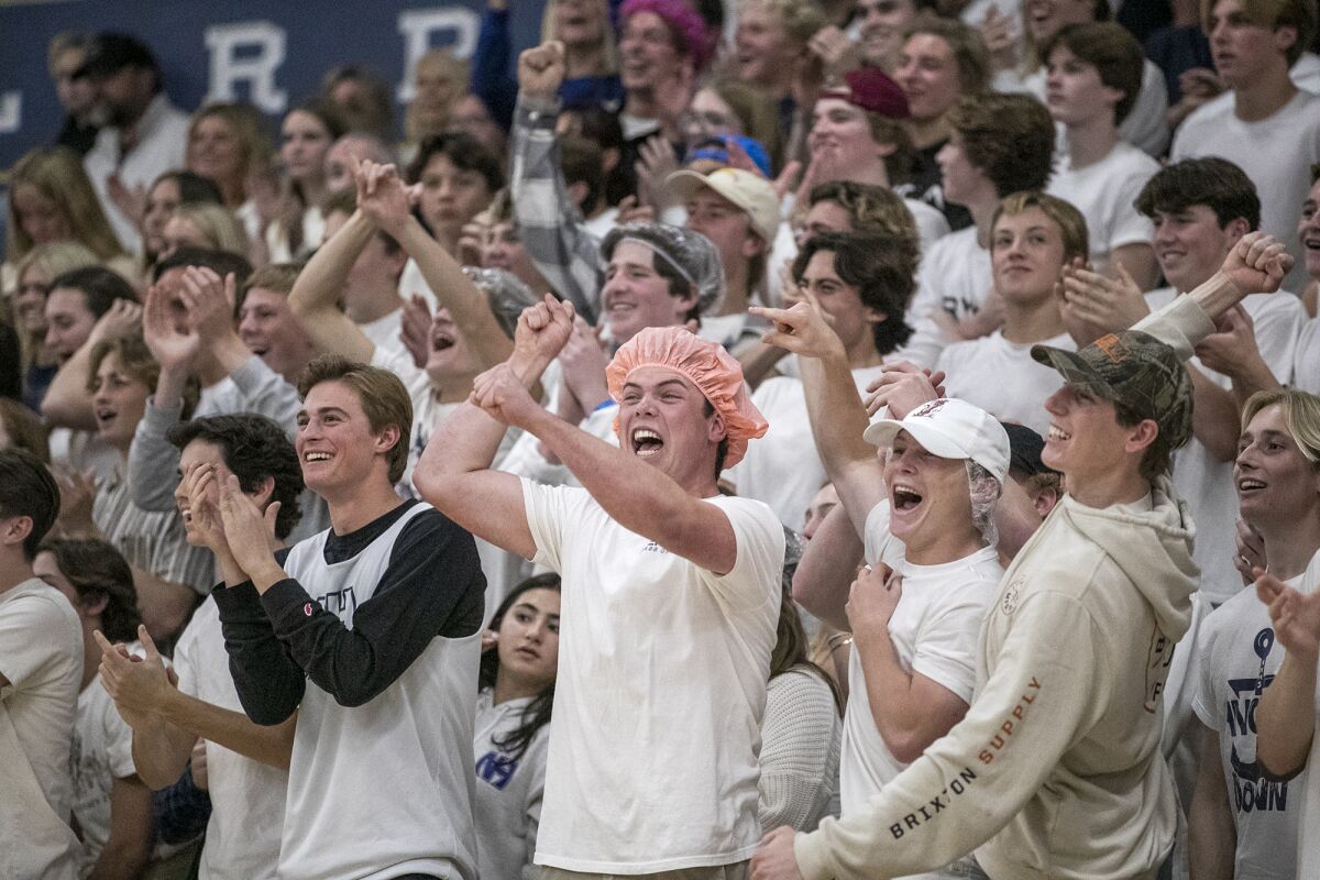 Newport Harbor's student section cheers during the first Battle of the Bay game against Corona del Mar on Wednesday.