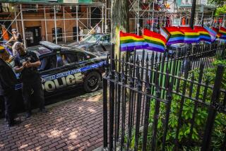 FILE - Pride flags, a symbol celebrating the LGBTQ+ community, decorate the fence at the Stonewall National Monument with U.S. Park police present, Tuesday, June 13, 2023, in New York. Dozens of LGBTQ+ Pride flags were damaged and ripped down at the monument over the weekend, the third such bout of vandalism during Pride Month at the LGBTQ+ landmark, police said. (AP Photo/Bebeto Matthews, File)